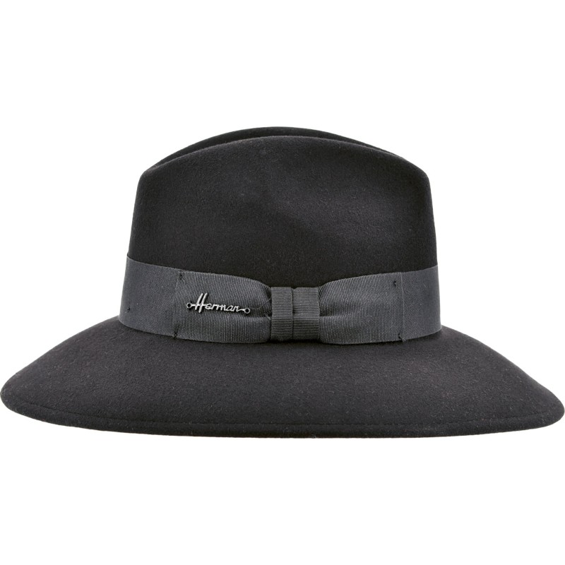 Women's hat with large brim in plain wool felt with fancy decoration.